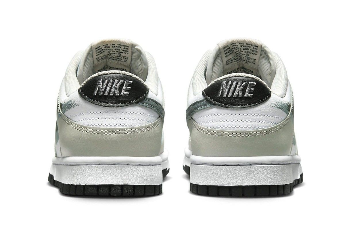 https___hypebeast.com_image_2022_10_nike-dunk-low-spray-painted-swoosh-FD0661-100-release-info-005.jpg